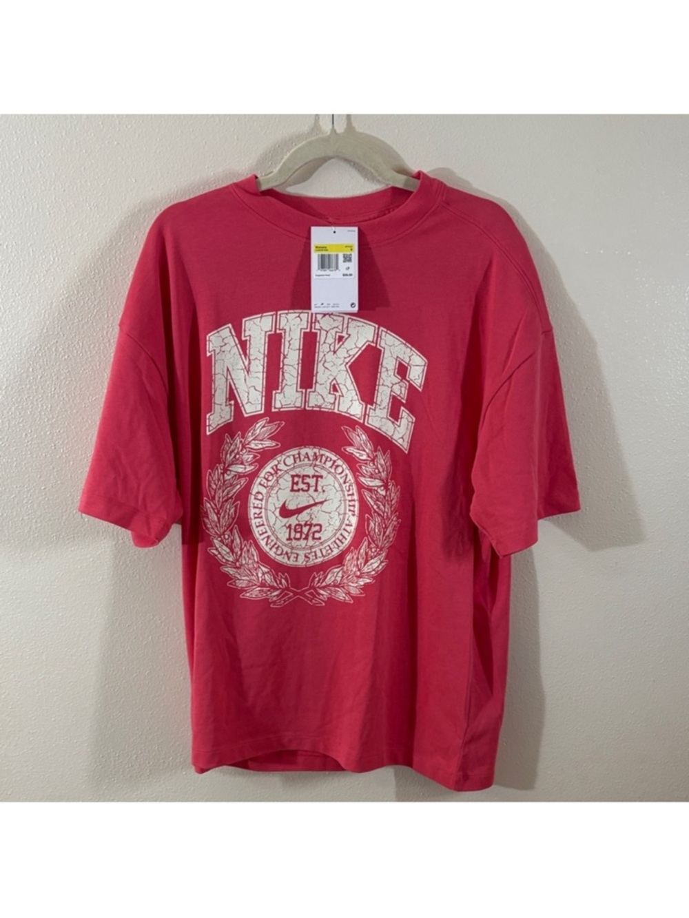 Nike Men's Short Sleeve Graphic Tee in Coral Pink with White Logo